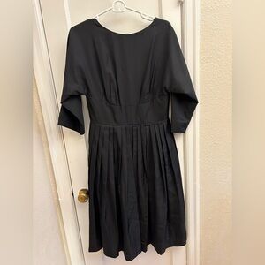 Brooks Brothers taffeta mini dress with V detail on back and corset style waist.